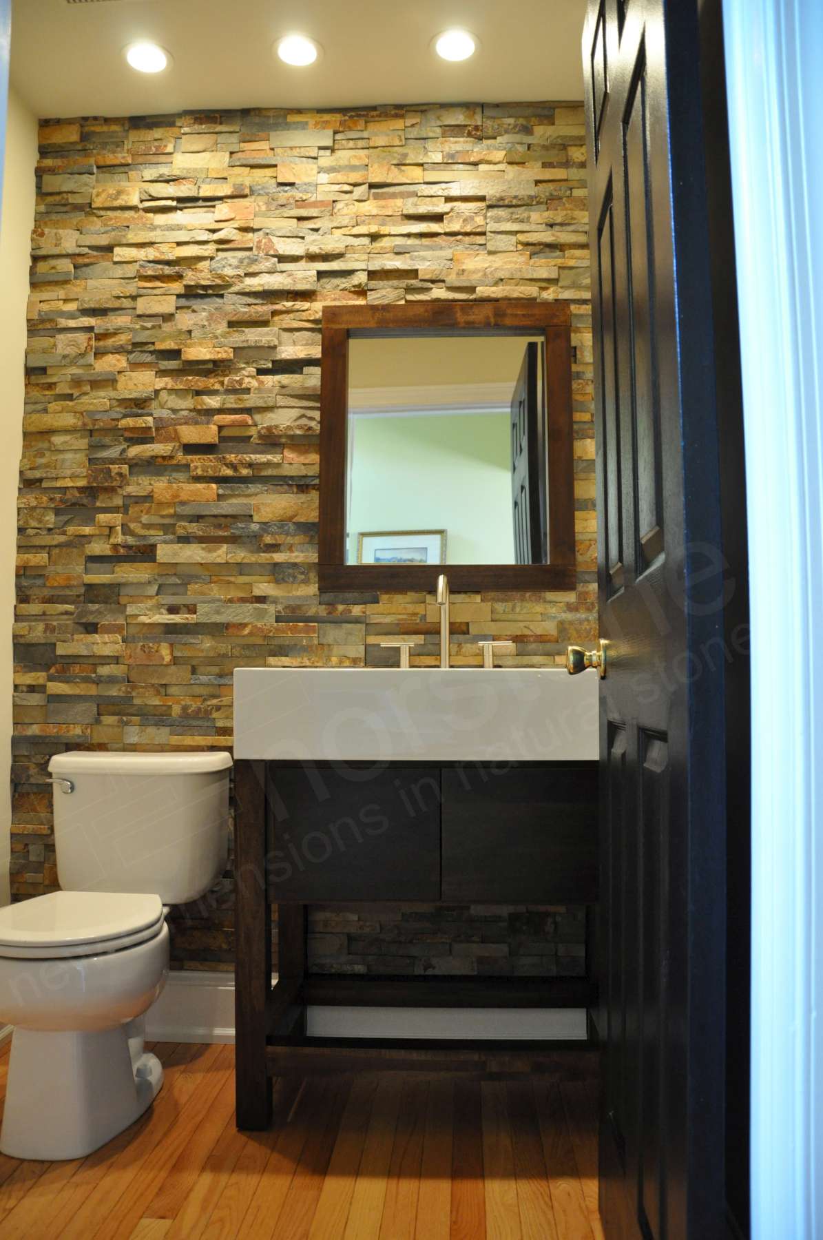 Small Powder Room with a stacked stone feature wall